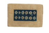 Vintage Distressed Oushak rug with cobalt blue geometric starbursts on a beige field, 1'4