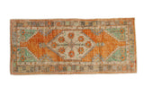 Distressed Oushak rug runner, terracotta shield medallion with blossoms, mint spandrels, 2'6