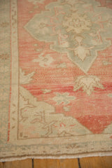 Even wear and heavy color abrashes on the hand-knotted pile of a vintage Oushak rug.