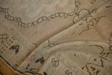 Detail of the soft, distressed texture and even wear on a hand-knotted vintage Oushak rug.