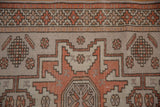 Distressed Oushak rug runner with geometric border and medallion detail, pale burnt orange, platinum.