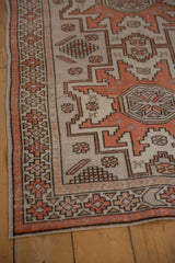 Distressed Oushak rug runner with geometric border, pale burnt orange and platinum patterns.