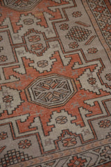 Vintage Oushak rug runner, distressed geometric pattern with pale burnt orange pomegranate motif.