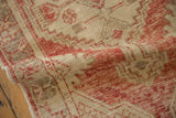 Distressed low pile and flexible hand-knotted weave of a vintage Turkish Oushak rug runner.