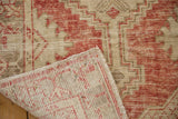 The hand-knotted foundation and worn pile of a vintage Turkish Oushak rug runner.