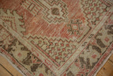Distressed corner spandrels of vintage Oushak rug runner in red blush and ivory tones.