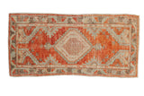 Hand-knotted distressed Oushak runner with brick red and pale blue diamond medallion.