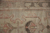 Vintage Distressed Oushak rug runner, close-up showing worn pile texture and dusty blush red patterns.