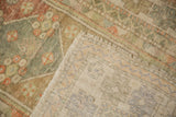 Back view of the hand-knotted foundation on a vintage distressed Turkish Oushak rug.