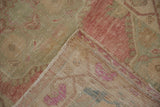 Close-up of the hand-knotted foundation and low, even wear of a vintage Turkish Oushak rug.