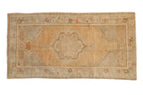 Distressed Oushak runner with a scalloped medallion, featuring a soft palette of pale gold, sand, and oxidized silver.