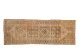 Distressed vintage Anatolian runner, beige and brown geometric medallions, soft blush accents, 2'8