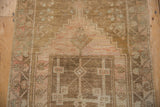 Heavy abrashes and geometric motifs with faded blush, beige, and coffee brown tones.