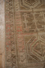 Distressed vintage Anatolian runner showing heavy abrashes, low pile, and muted blush geometric patterns.