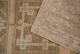Distressed Anatolian rug pile with brown, beige abrashes, wear, and hand-knotted reverse.