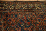 Meandering vine border, Herati motifs on antique Hamadan rug, madder red, sapphire blue, aged pile.
