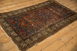 Antique Hamadan rug: Herati design in madder red, sapphire blue, and ivory meandering vine border.