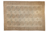 Distressed vintage Ersari carpet, repeating geometric guls on abrashed beige ground, 8'1