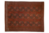 Distressed vintage Ersari rug in chestnut red with geometric guls in charcoal, blush, lime, 7'6