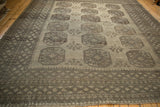 Distressed vintage Ersari rug with geometric gul, snowflake blossoms, and wear.