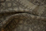 Distressed vintage Ersari carpet pile with softened geometric patterns in muted earthy tones.