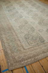 Distressed vintage Ersari carpet corner with secured side selvage and geometric border.