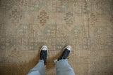 Distressed Oushak carpet pile featuring soft ivory, beige, and pale blue patterns.