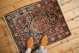A small vintage Josan Sarouk rug with a traditional floral pattern shown to scale.