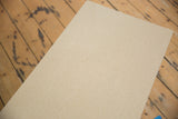 Textured light wood surface of the vintage mid century coffee table.