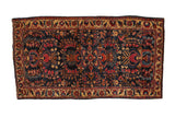 Antique Mohajeran Sarouk rug with a Tree of Life design and gem-toned florals on a deep blue field.