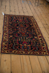 Angled view of a Mohajeran Sarouk runner's dense Tree of Life design on a deep blue ground.