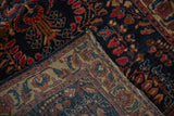Hand-knotted foundation and knot heads on the back of an antique Persian Sarouk rug.