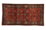 Vintage Persian Hamadan rug with an allover Herati design in gem-tones of ruby red and sapphire blue.