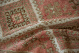 Close-up showing the even wear to the knot heads of a hand-knotted Kurdish runner.