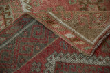 Folded corner of a vintage Kurdish rug showing its even wear and hand-knotted back weave.