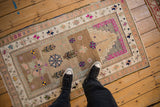 Distressed vintage Oushak rug, abrashed field, germinating trees, magenta, and ochre tones.
