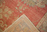 Secured selvage and hand-knotted foundation on the back of a distressed Oushak rug.