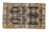Distressed vintage Turkish Oushak rug with dark denim royal blue and beige geometric patterns.