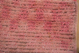 Close-up of the hand-knotted Tulu pile showing distressed texture and abrashes.