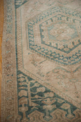 Close-up of a vintage Oushak rug's side showing mostly even wear across the low, hand-knotted pile.