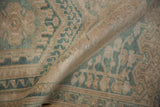 Softly worn, hand-knotted pile of a distressed vintage Turkish Oushak rug.