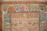 Vintage Oushak runner detail: hook and latch patterns, tangerine, magenta, teal, heavy abrash.