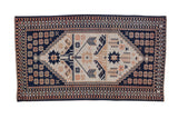 Vintage distressed Dosemealti rug runner with geometric blossoms in navy blue, dusty rose, and sand.