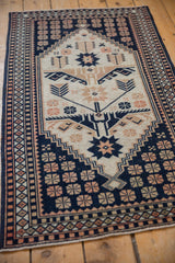 A vintage Dosemealti rug runner seen from an angle, showing its full geometric pattern.