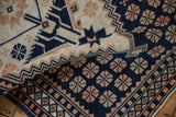A curled corner of the vintage Dosemealti rug reveals its pliable, hand-knotted foundation.