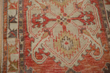 Mostly even wear showing the knot heads and texture of this vintage distressed Oushak runner.