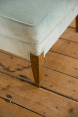 Vintage baby blue mohair footstool corner with soft velvet, contrast piping, and carved leg.