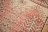 Distressed vintage Oushak runner showcasing blush, cream tones, visible knot heads, and secured edge.