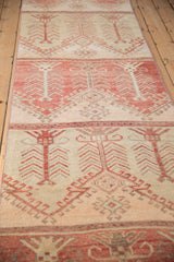Vintage Oushak runner with germinating tree of life motif in alternating faded raspberry and cream.