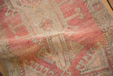 Vintage distressed Oushak rug, short pile with abrashed blush and beige tones.